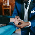 Capturing a romantic proposal moment as a man places an engagement ring on a woman
